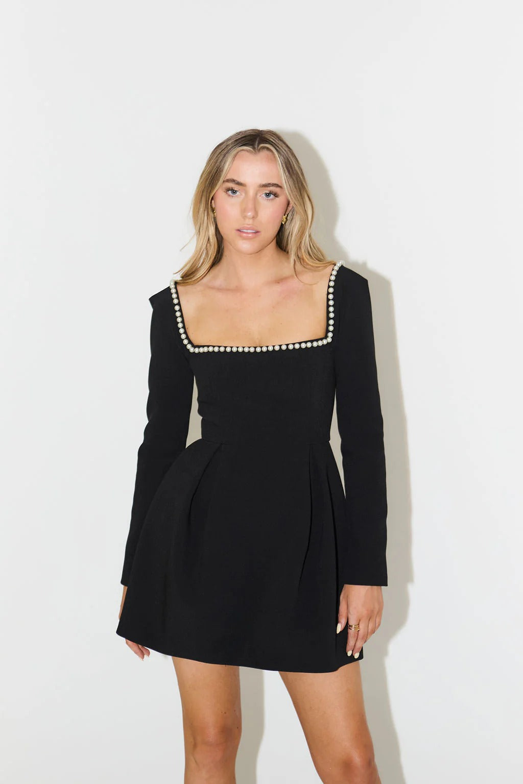Elegant pearl trim mini dress with long sleeves for women, perfect for cocktail parties.