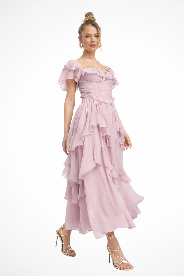 Women's pink off-shoulder ruffle corset & tiered maxi skirt set for elegant party and event wear.