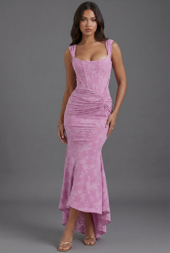 Elegant pink women's sculpting corset maxi dress. Perfect formal attire for a wedding guest or special occasion.