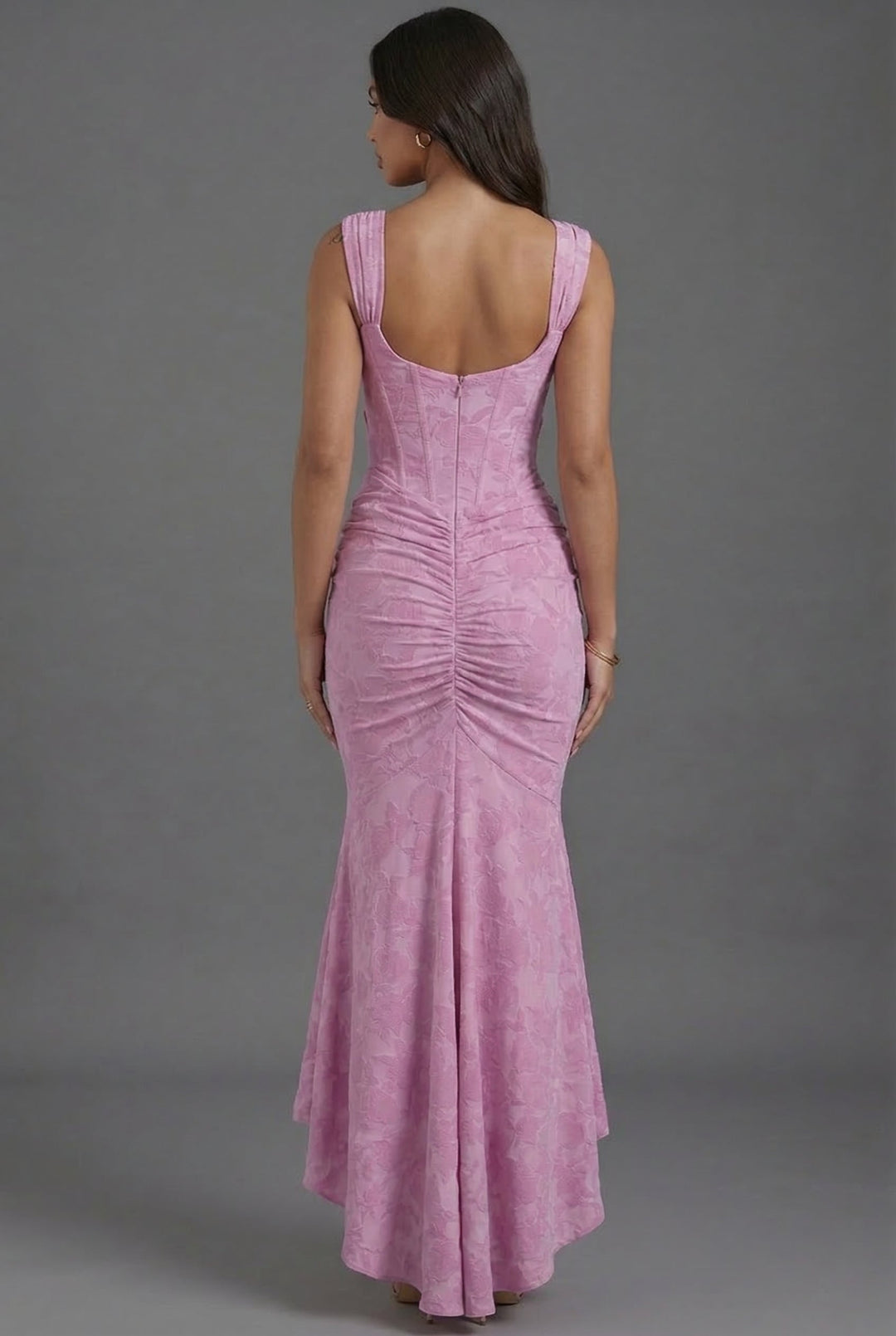 Pink sculpting corset maxi dress. Elegant women's formal wear, perfect as a wedding guest or special occasion gown.