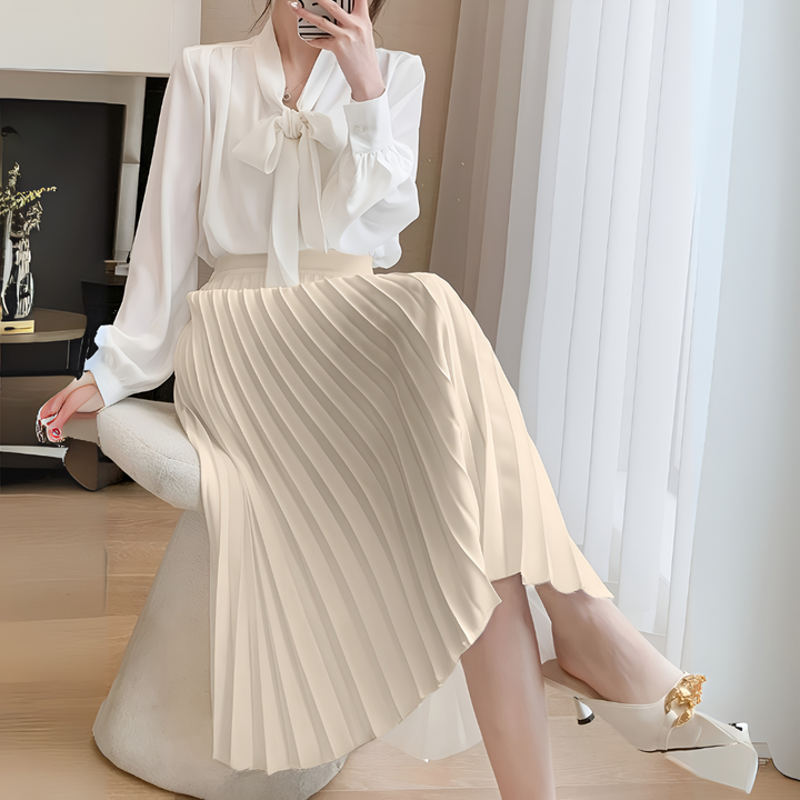 New women's elegant pleated midi skirt with a high-waist. Versatile fashion for formal events or casual outings.