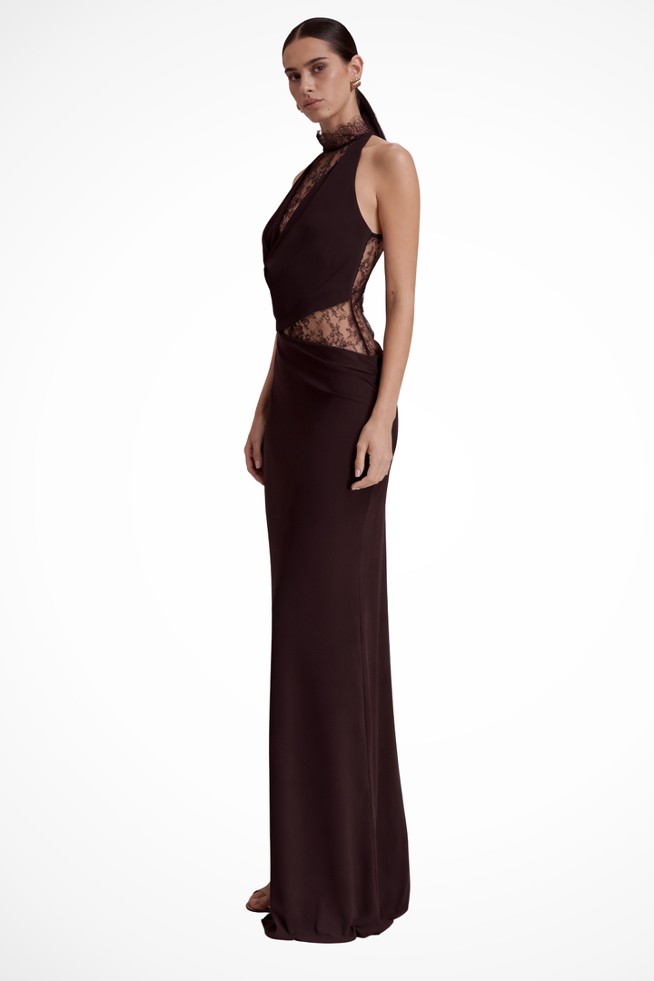 Floor-length red brown halter neck maxi dress with intricate patterned detail for an elegant look.