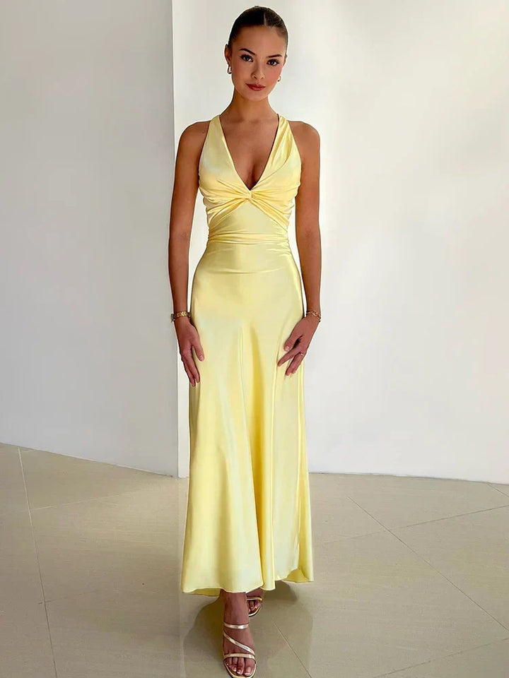 Elegant satin halter neck evening dress for women with sleek silhouette and glossy finish, perfect for formal events.