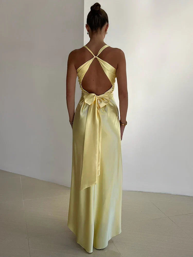 Elegant satin halter neck evening dress for women with sleek silhouette and glossy finish, perfect for formal events.