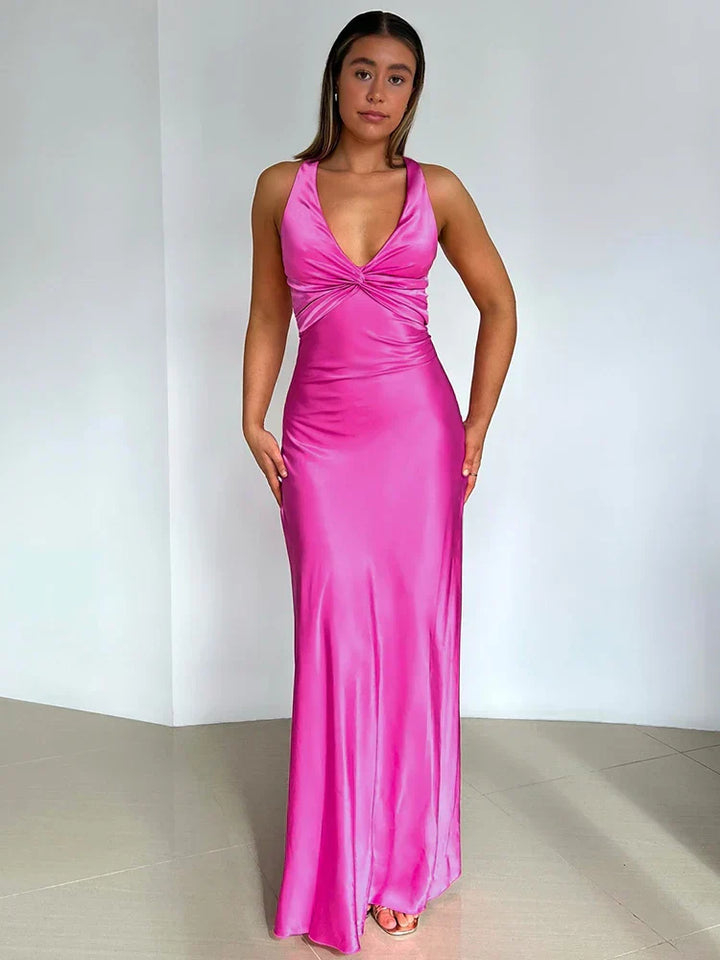 Elegant satin halter neck evening dress for women with sleek silhouette and glossy finish, perfect for formal events.