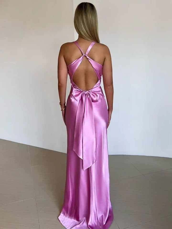 Elegant satin halter neck evening dress for women with sleek silhouette and glossy finish, perfect for formal events.