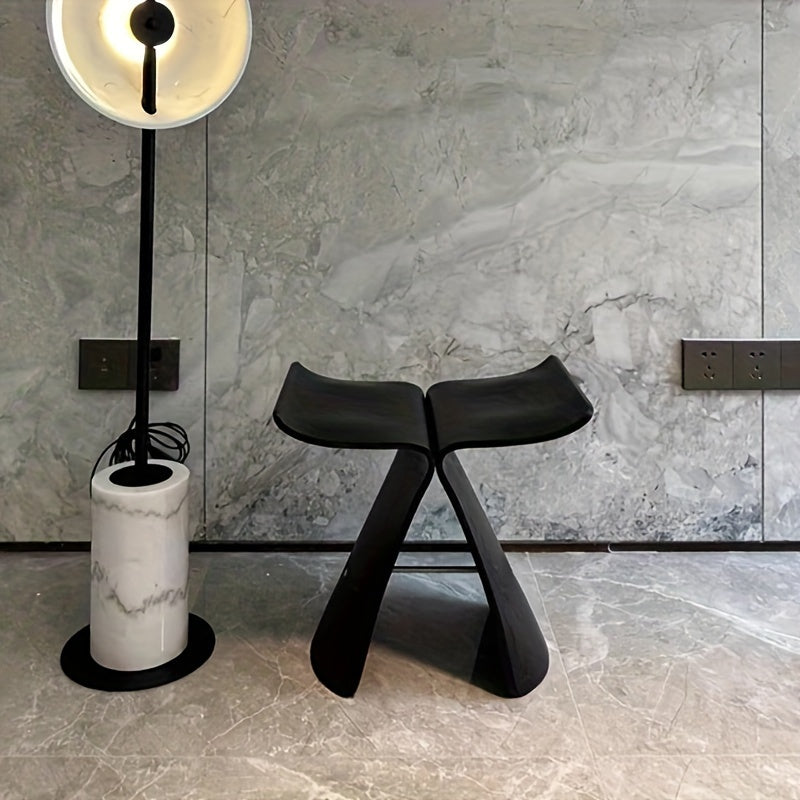 Decorative solid wood butterfly stool, a modern vintage accent piece, enhancing any room's aesthetic.