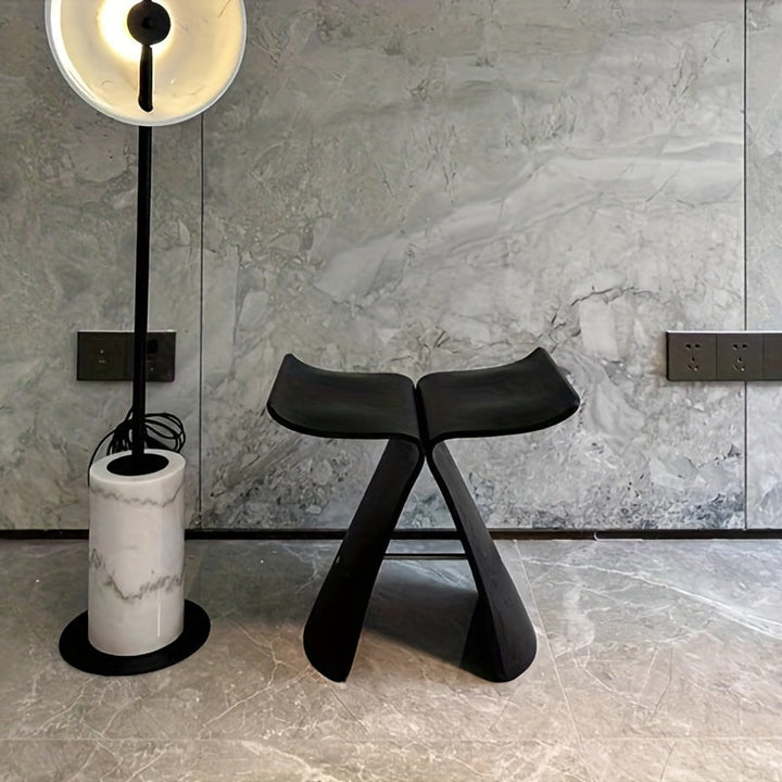 Decorative solid wood butterfly stool, a modern vintage accent piece, enhancing any room's aesthetic.