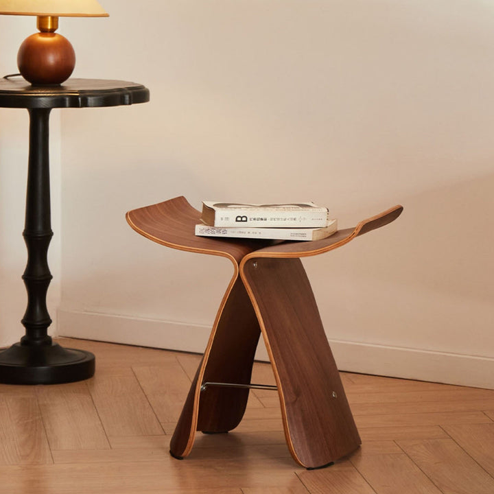 Timeless butterfly stool, versatile solid wood accent furniture for living room or entryway decor.