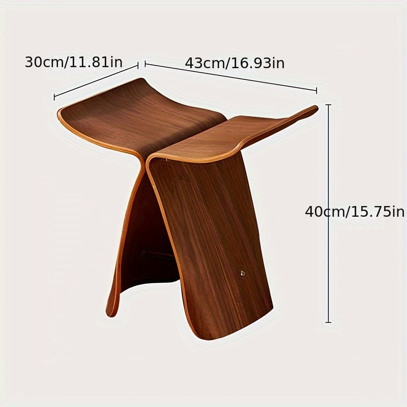 Elegant solid wood butterfly stool, a timeless piece of accent furniture for versatile home styling.