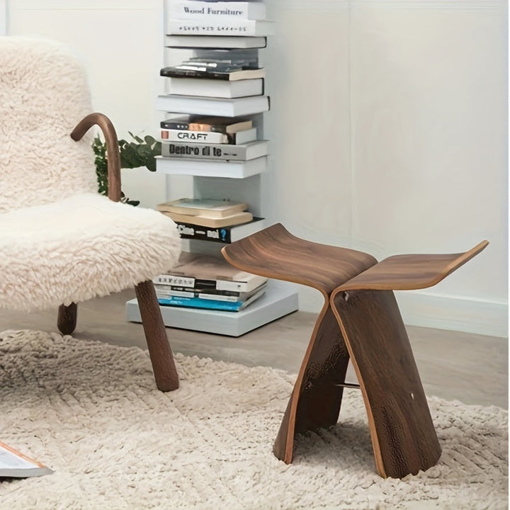 Iconic butterfly stool, solid wood construction, modern home decor accent, enhancing interior design.