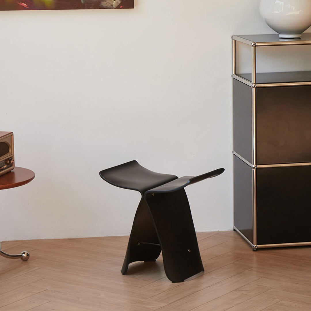 Mid-century modern inspired butterfly stool, solid wood, elegant home accent for sophisticated spaces.