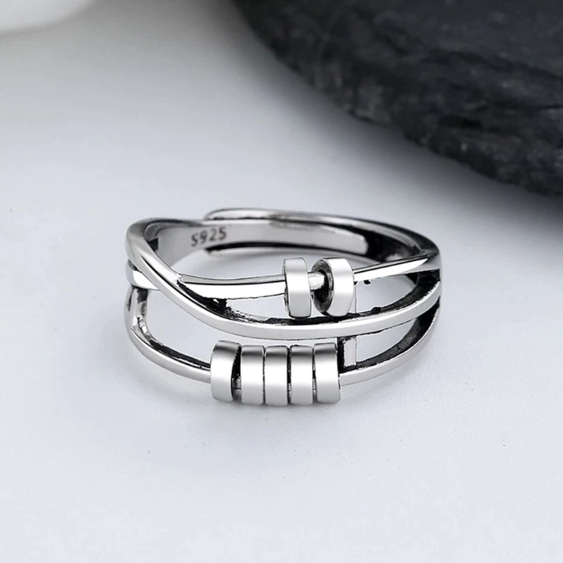 Elegant sterling silver fidget spinner ring for anxiety relief. Unisex, adjustable, and stylish anti-stress jewelry.