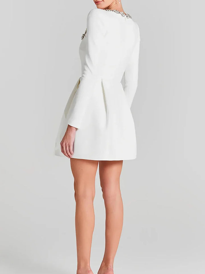 Chic women's white mini bridal dress, square neck & long sleeves. Modern wedding attire.
