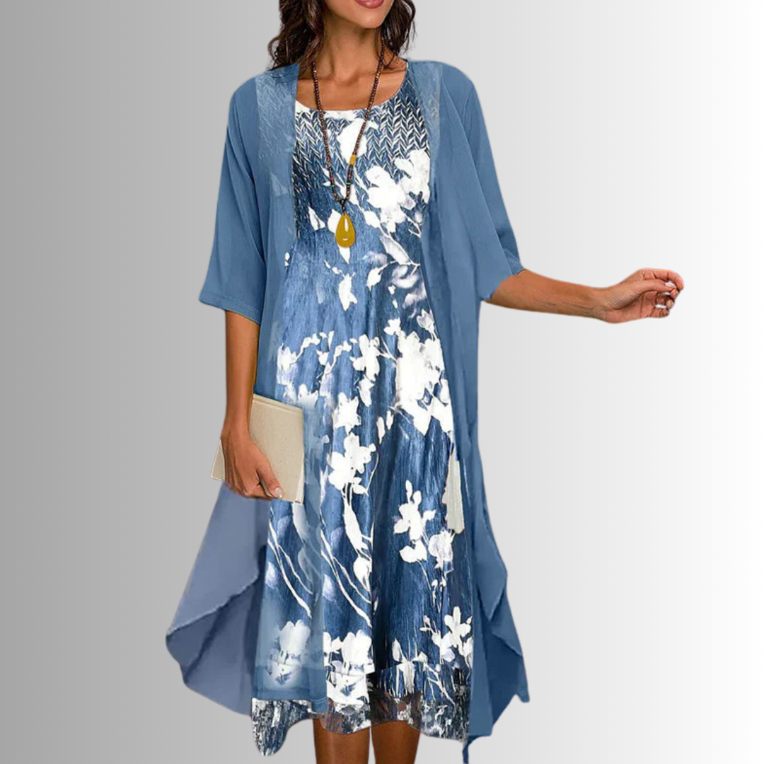 Chic women's two-piece summer outfit featuring a relaxed fit flowy blouse and elegant dress combo.