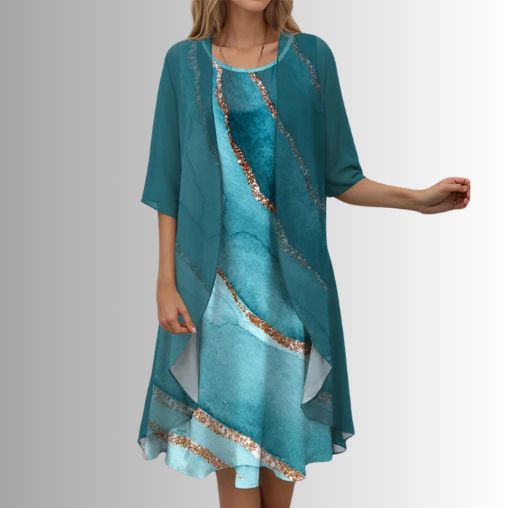 Comfortable women's summer set with a stylish flowy blouse and dress, ideal for elegant day wear.
