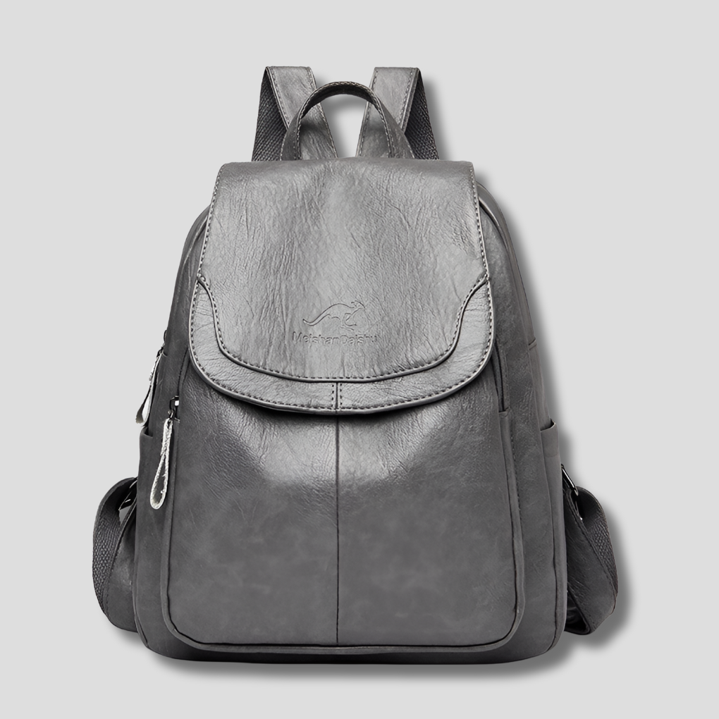Elegant women's anti-theft leather backpack with embossed detail, a secure fashion accessory.