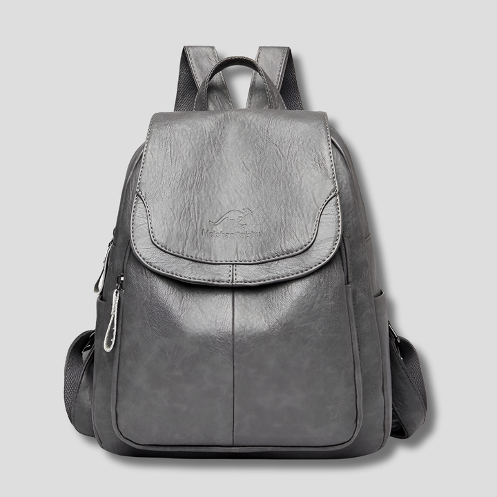 Elegant women's anti-theft leather backpack with embossed detail, a secure fashion accessory.