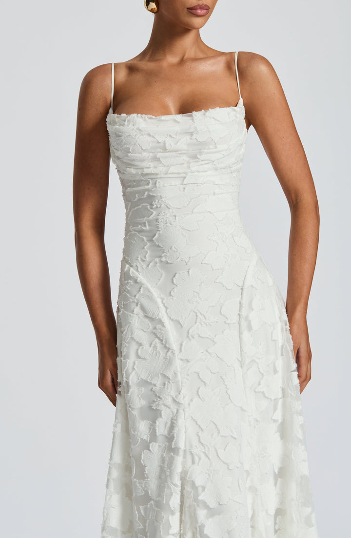 Stylish women's backless party dress, a long maxi with spaghetti straps, perfect for summer.