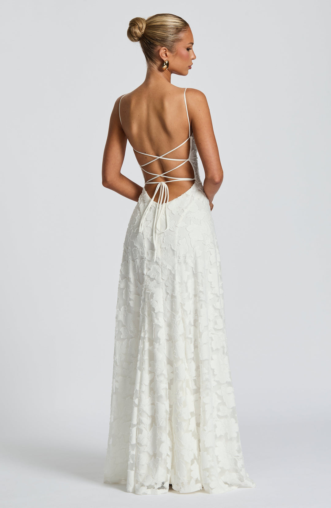 Gorgeous women's backless maxi dress with spaghetti straps, perfect for elegant summer evenings.