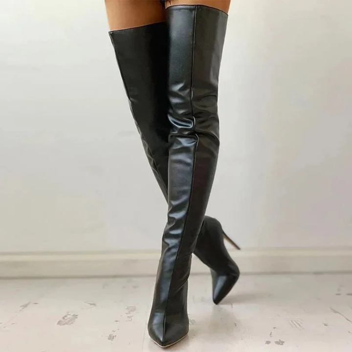Stylish women's over-the-knee boots with pointed toe, high heel, and zipper closure, ideal for parties.