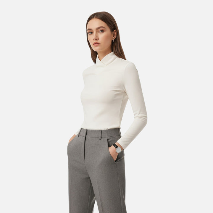 Chic long sleeve criss-cross top for women, versatile for elegant workwear, fall fashion, or winter style.