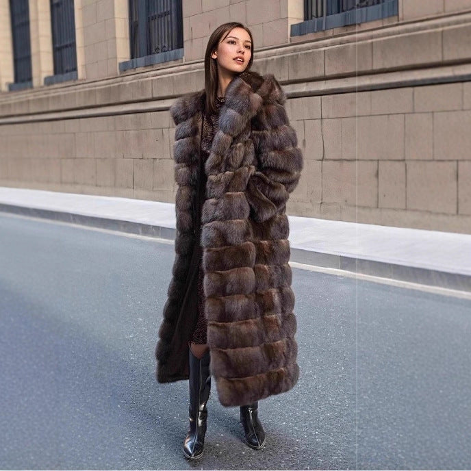 Chic women's faux fur winter jacket with a cozy hood, offering elegant warmth for cold weather.