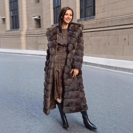 Brown hooded faux fur coat for women, an elegant and warm winter outerwear piece with a fashionably chic style.