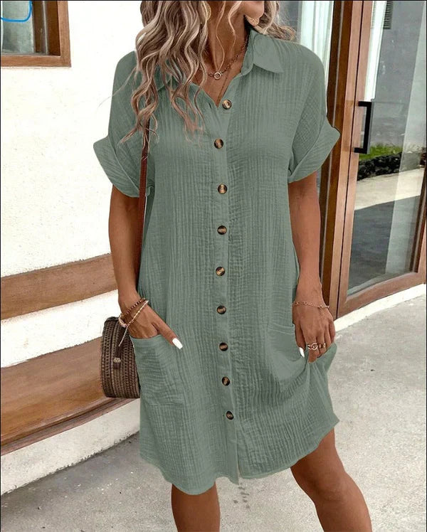 Versatile women's button-front shirt dress, an elegant collared dress suitable for casual spring & summer wear.