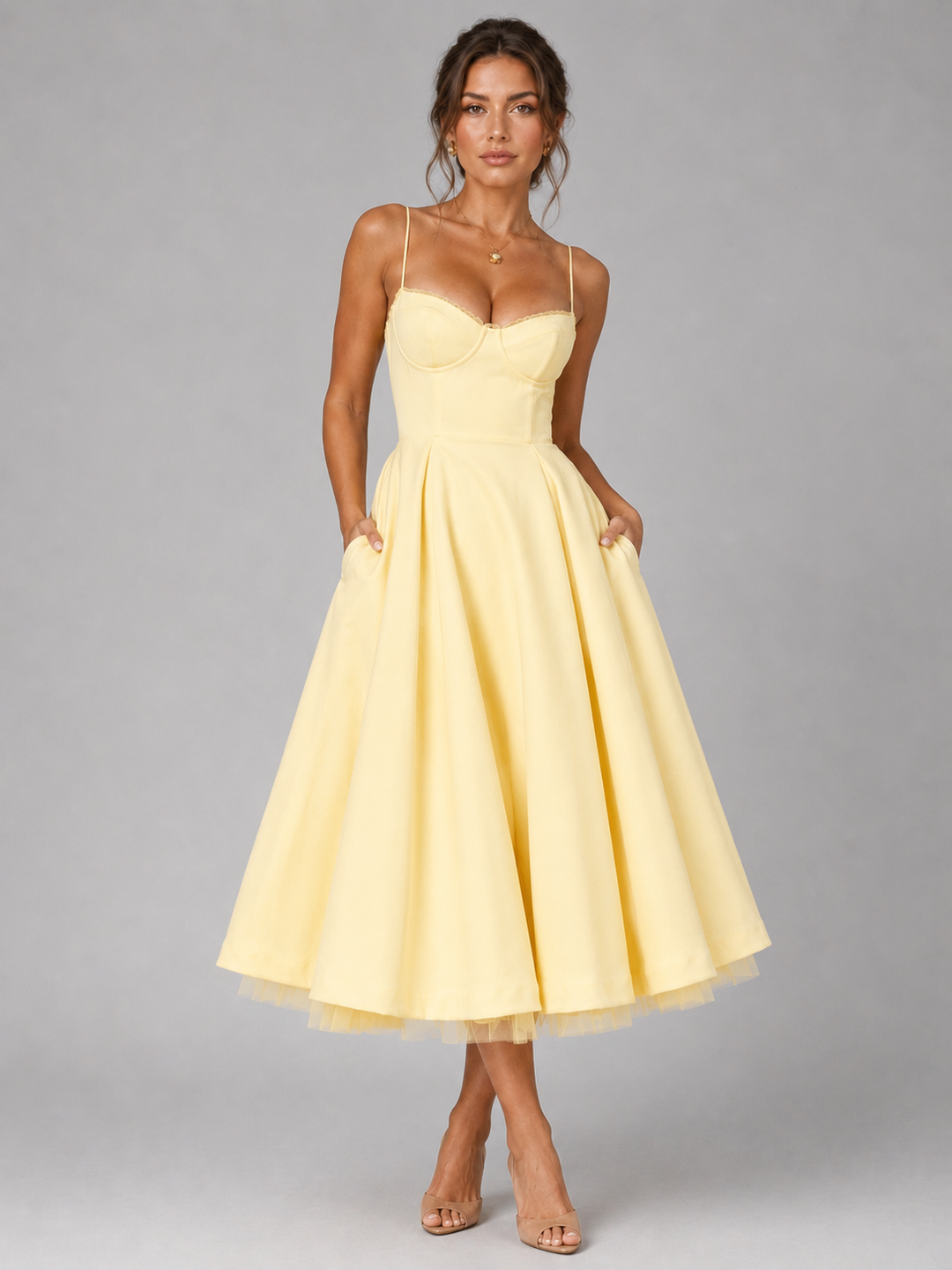 Detailed view of a women's elegant midi dress fabric, showing the corset bodice texture and full skirt drape.