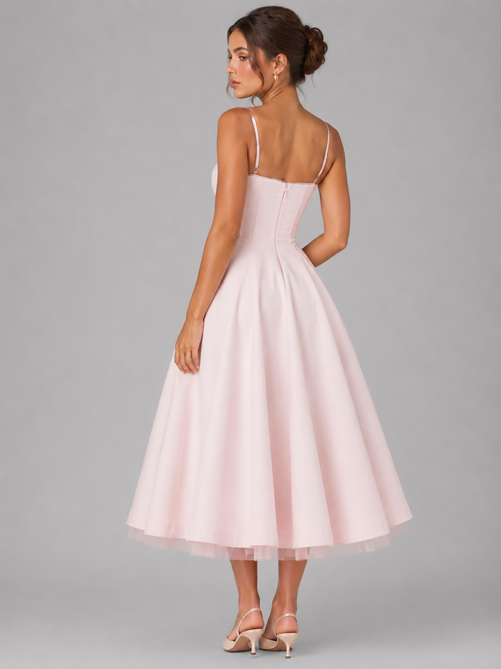 Flowy full skirt midi dress for women, featuring a flattering corset top, perfect for elegant summer wear.