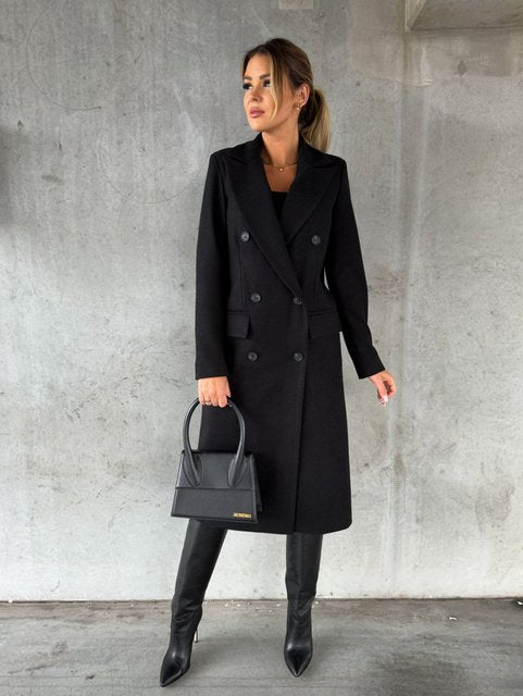 Women's double-breasted winter jacket with elegant buttons, perfect for chic cold weather.