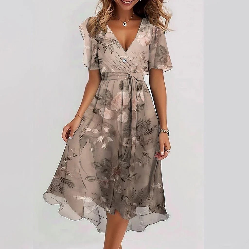 Vibrant women's floral print midi dress, elegant & comfortable for summer. Features flutter sleeves.