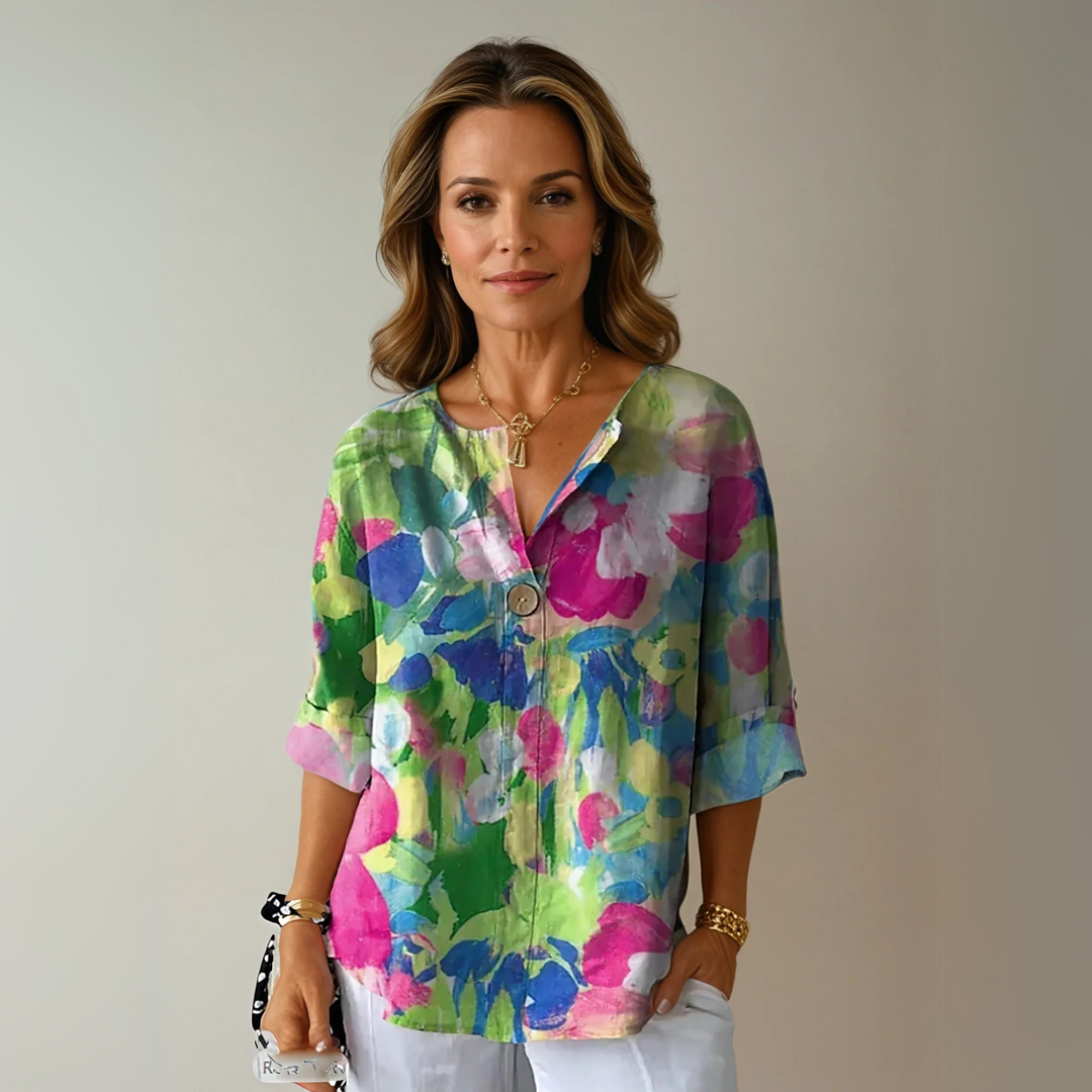 Trendy women's floral blouse, 3/4 sleeve, button-down design for chic spring and summer fashion.