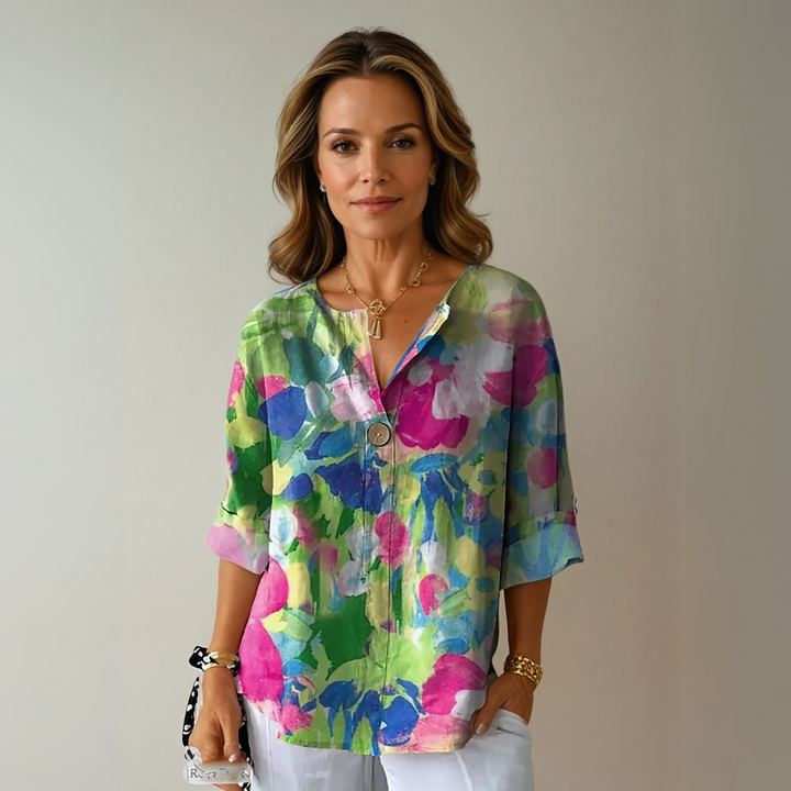 Trendy women's floral blouse, 3/4 sleeve, button-down design for chic spring and summer fashion.