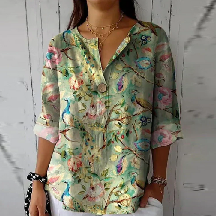 Casual elegant women's floral 3/4 sleeve button-down blouse, perfect for warm weather and spring style.