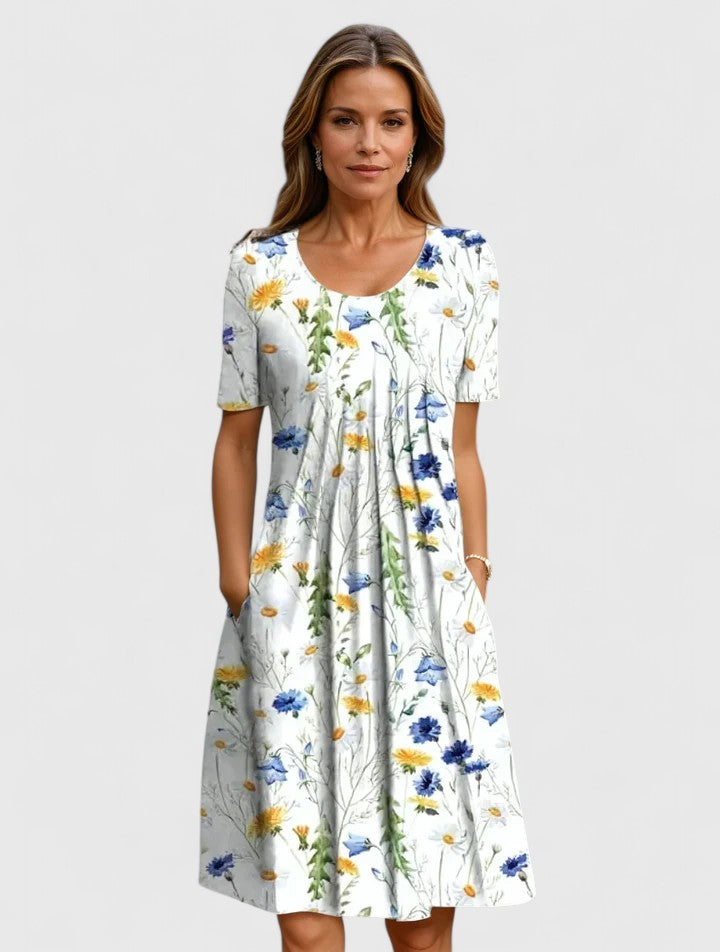 Elegant women's floral summer midi dress with short sleeves and practical pockets, perfect for casual or party wear.