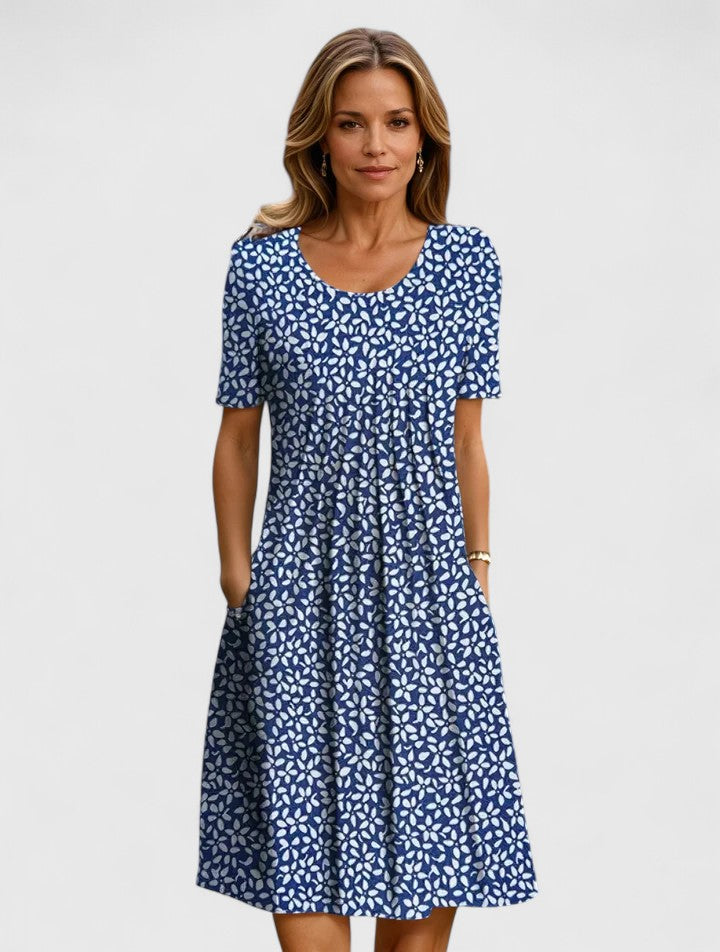 Beautiful women's floral summer dress, elegant midi length with short sleeves and useful pockets. Great for any occasion.