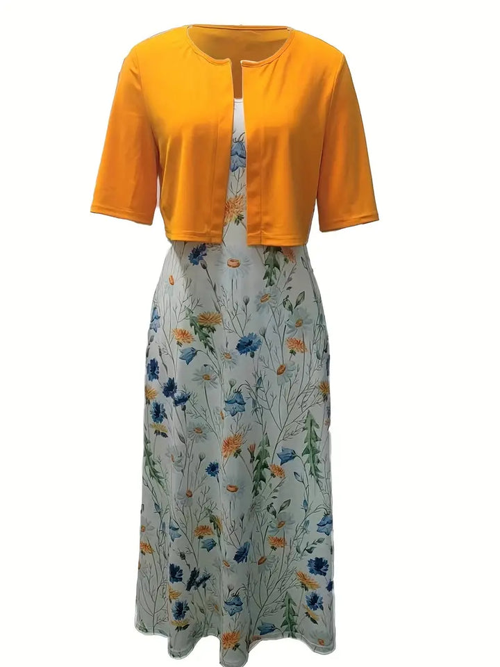 Vibrant floral print women's two-piece dress set. Elegant crop top & skirt combo for stylish summer and special occasions.