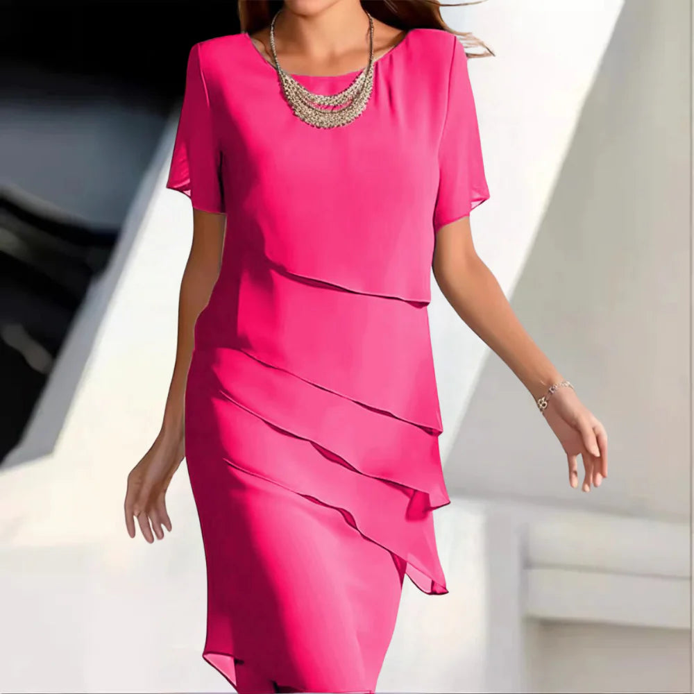 Versatile women's midi dress, comfortable & flowy, ideal for elegant spring & summer outfits. Round neck, short sleeve.