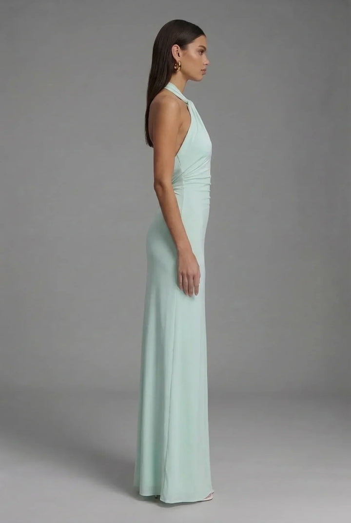 Formal women's ruched maxi gown, a chic halter neck backless design for wedding guests & special occasions.