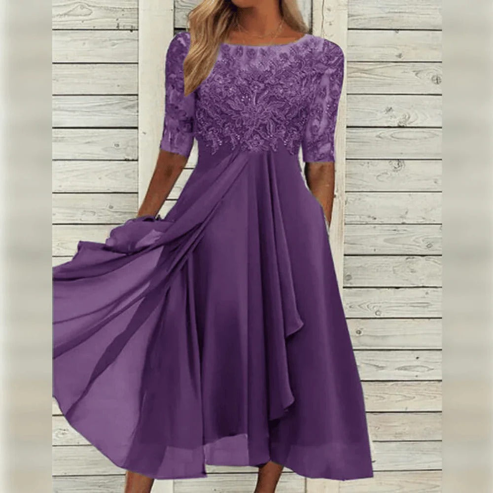 Elegant women's lace midi dress, perfect for festive occasions. Features a flowing skirt & three-quarter sleeves.