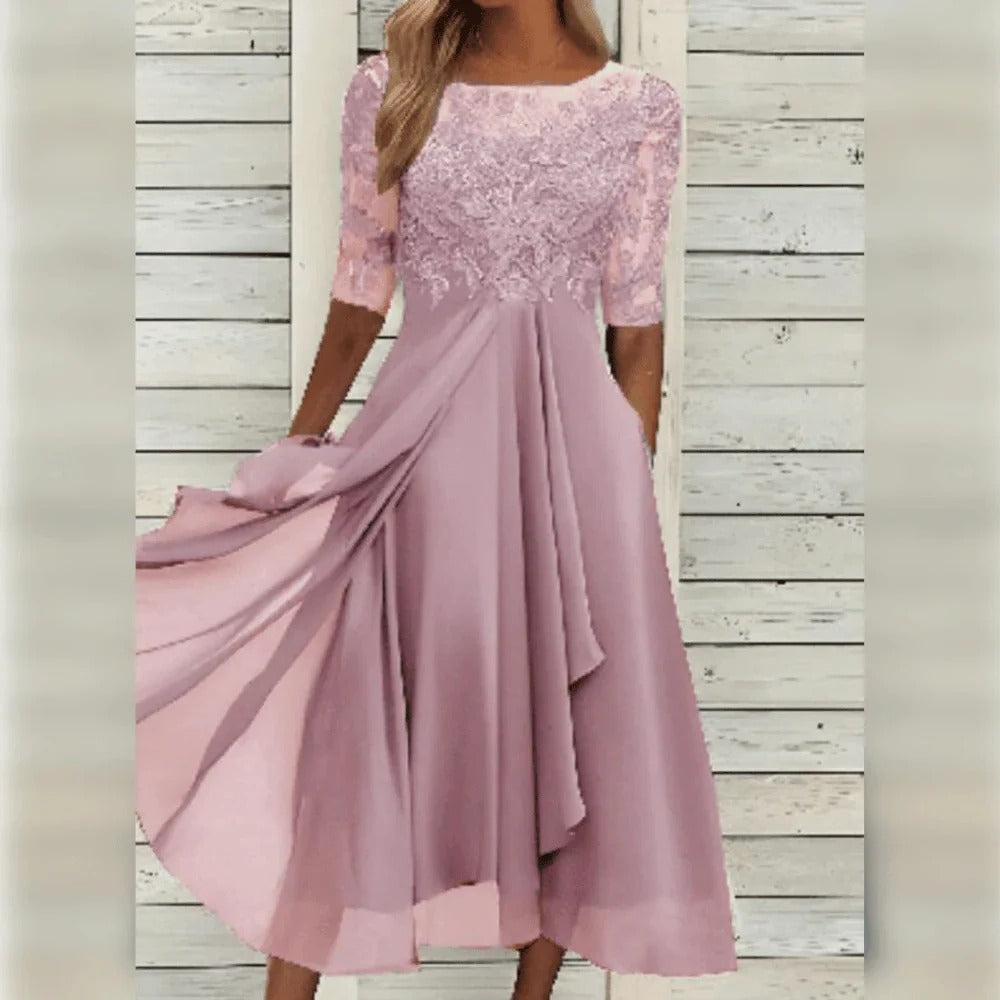 Stylish women's occasion midi dress with intricate lace details and a flattering flowing skirt.