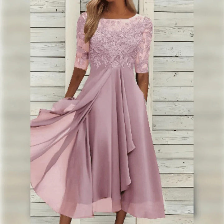 Stylish women's occasion midi dress with intricate lace details and a flattering flowing skirt.