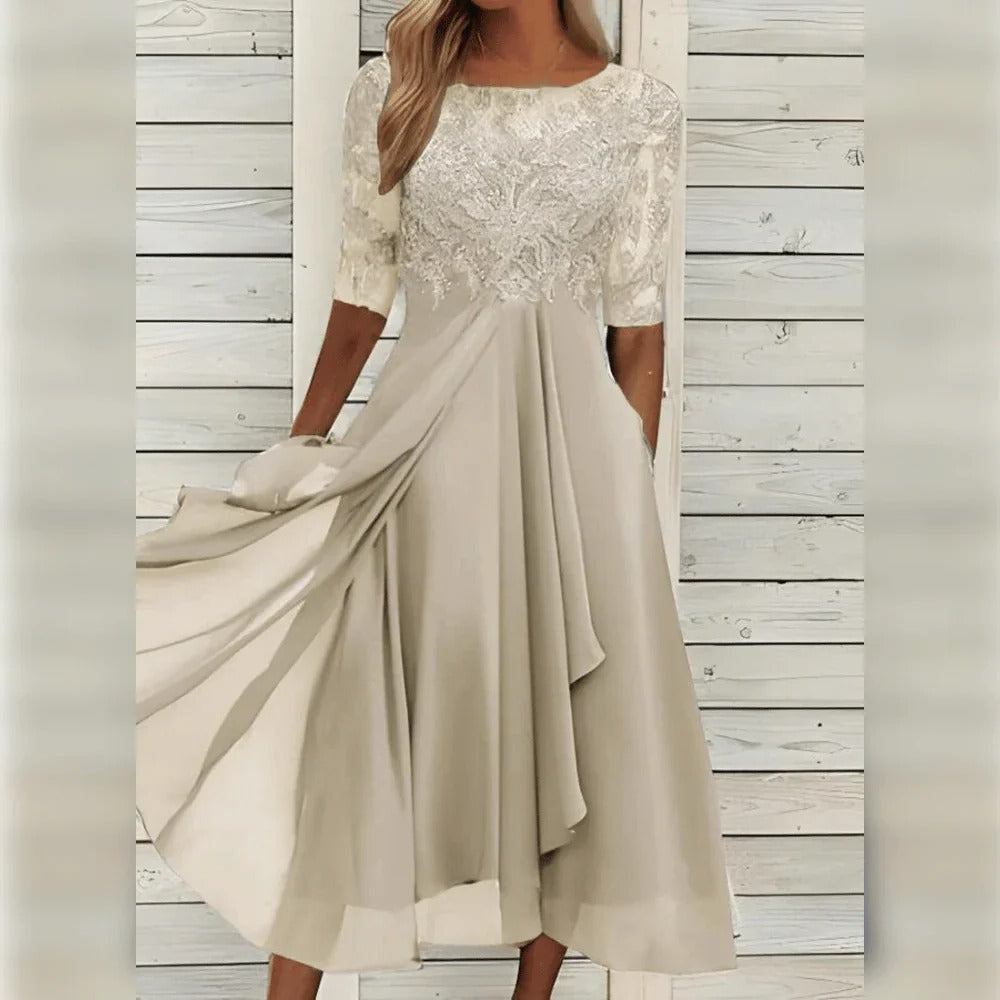 Beautiful women's lace party dress, midi length, with elegant round neck and a lovely flowing skirt.