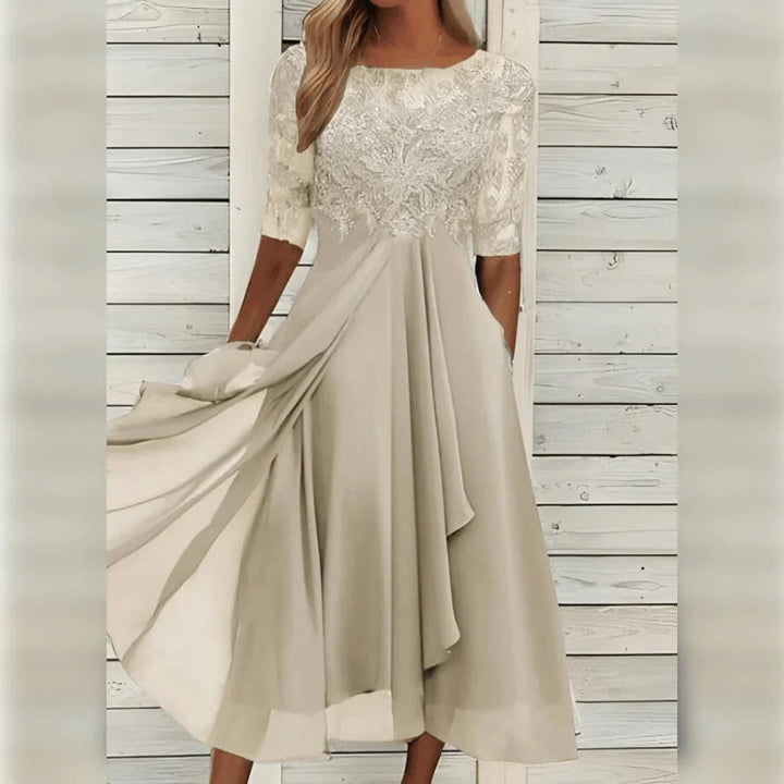 Beautiful women's lace party dress, midi length, with elegant round neck and a lovely flowing skirt.