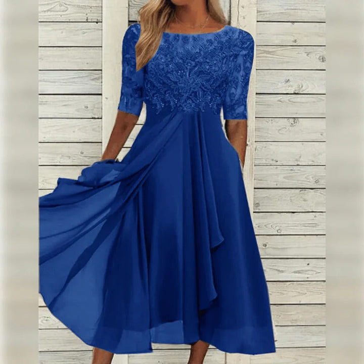 Women's chic lace midi dress, perfect for festive events, featuring three-quarter sleeves and a flowing silhouette.