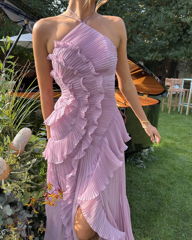Stunning white ruffle maxi dress for women, designed with an elegant halter neckline, suitable for summer events.
