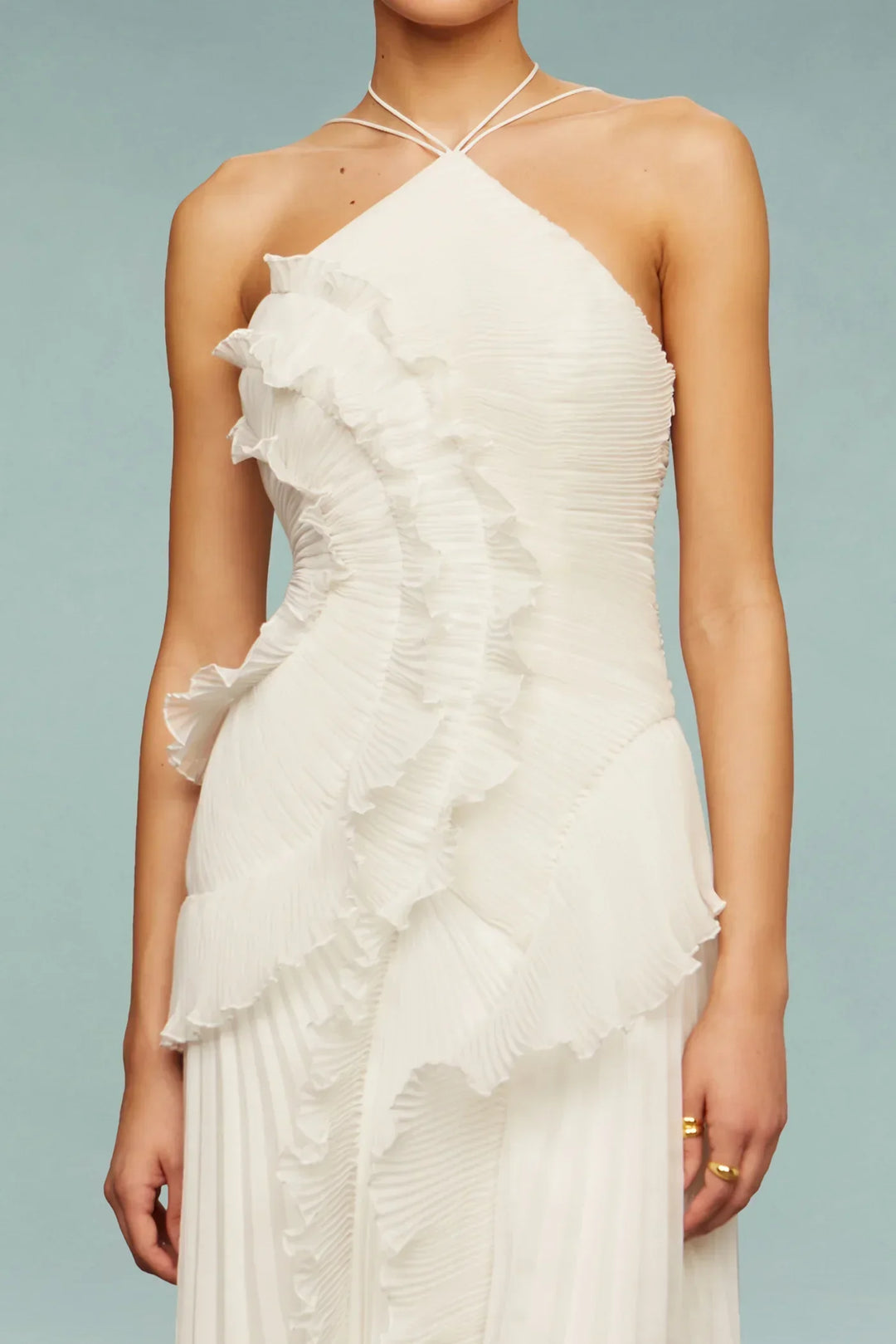 Flowing white ruffle maxi dress for women, featuring a chic halter neck, perfect for wedding guest attire.