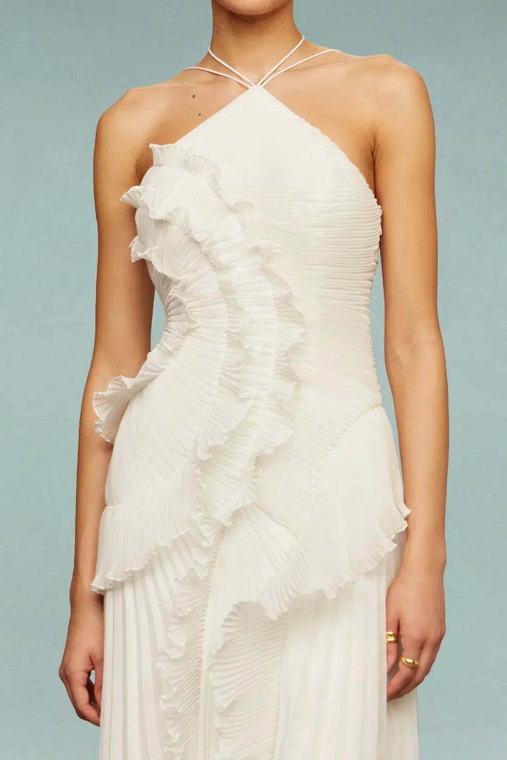 Flowing white ruffle maxi dress for women, featuring a chic halter neck, perfect for wedding guest attire.